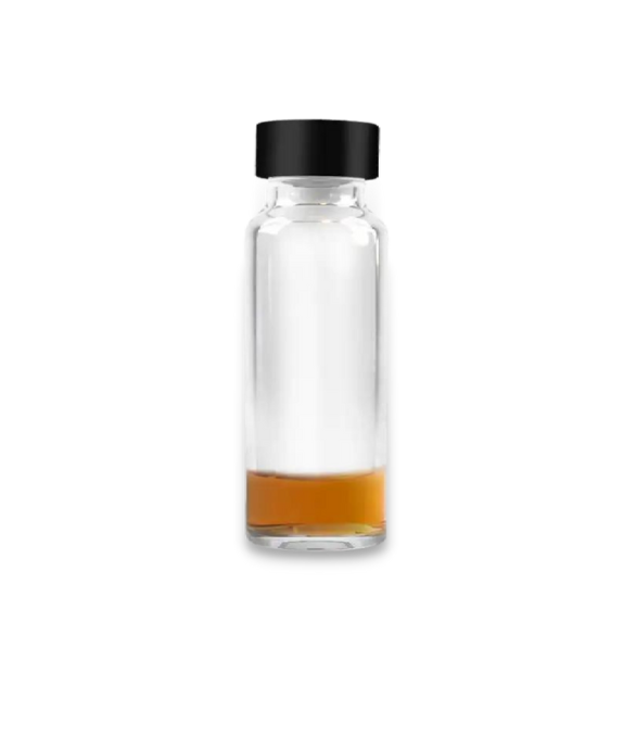 oil based vitamin in a glass jar. The oil looks very dark and brown.